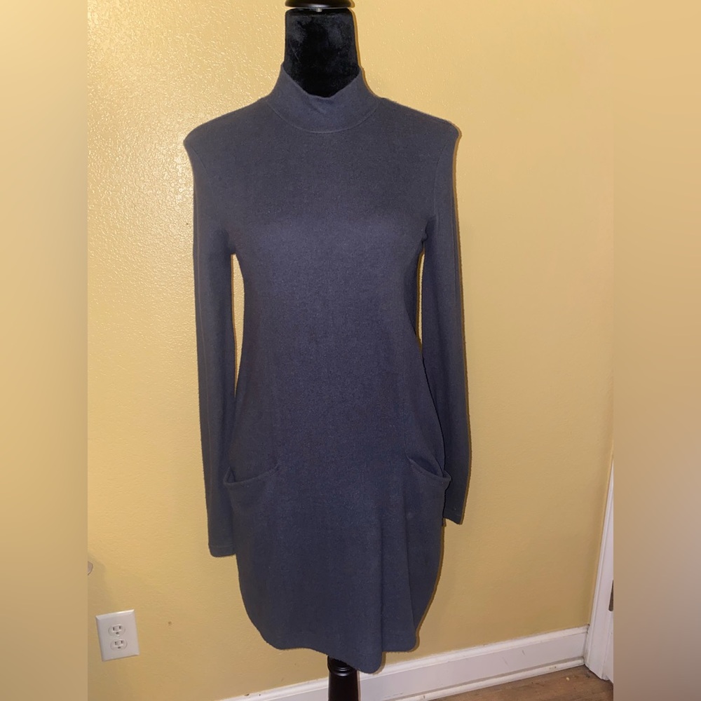 Grey long sleeve dress. Soft material. Has pockets.